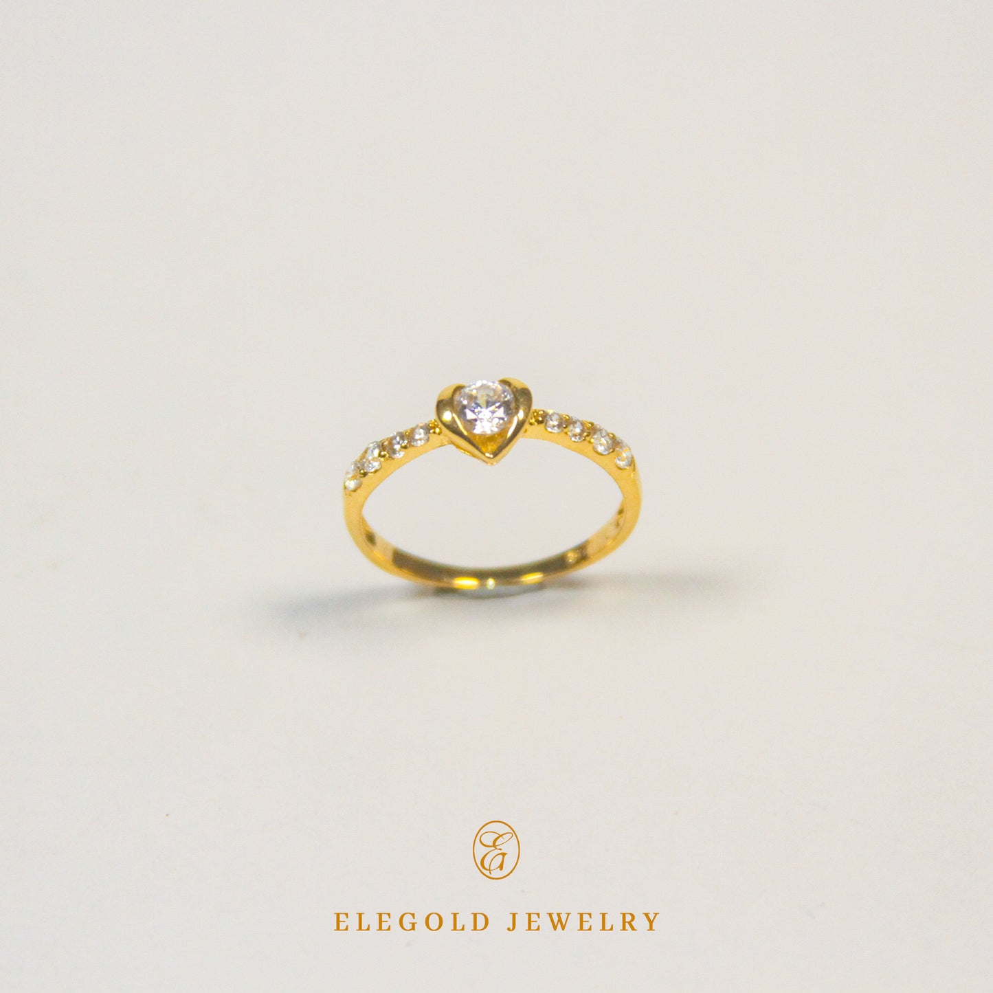 Elegold Heart Shape CZ Side Stone Gold Ring